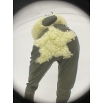 Green star faux leather trousers